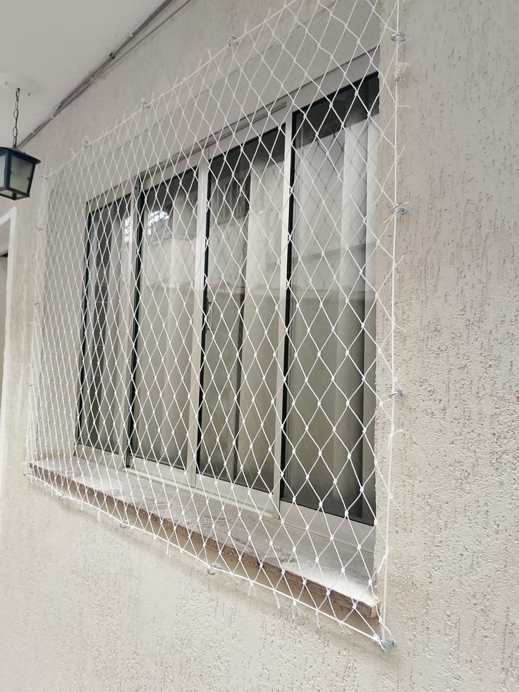 Safety net installed over open bedroom window